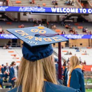 Back of student's head wearing a graduation cap.